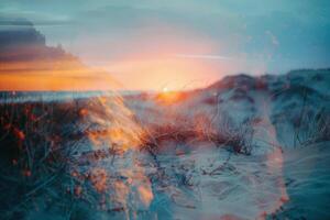 The sun sets beyond the horizon, casting warm colors across the sky and reflecting on the calm ocean water, while gentle waves lap against the sandy shore photo