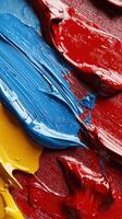 A painting of a red, yellow, and blue brushstroke photo