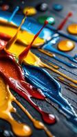 A painting of splatters of paint with a splash of red in the middle photo