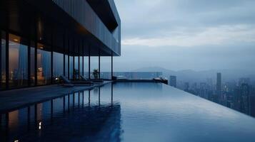 A pool in front of a building overlooking the city photo