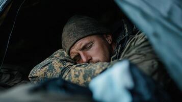 A man is sleeping in a tent photo
