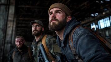 Three men with beards and military gear are standing in a dark room photo