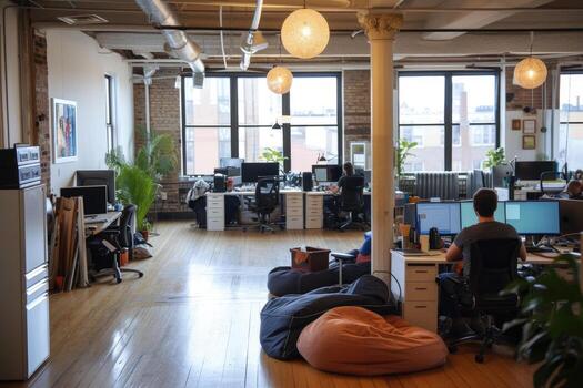 A large open office with lots of desks and computers photo