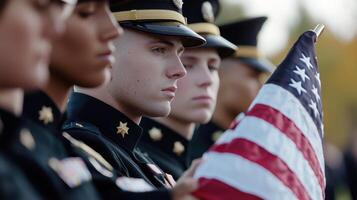 A group of military men stand in a line and hold a flag photo