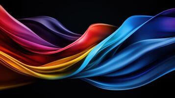 A colorful, flowing piece of fabric with a black background photo