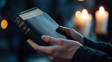 A person is holding a book in their hands photo