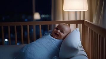 A baby is smiling and laying in a crib with a white pillow photo