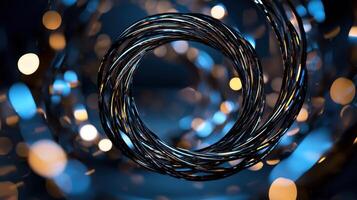 A spiral of wires with a blue background photo