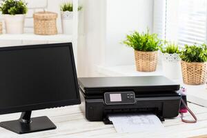 Printer and computer. Office table photo
