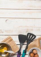 baking preparation, top view of a variety of baking utensils and ingredients photo