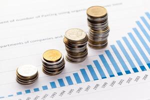 Graph Of Stock Market With Stacks Of Coins photo