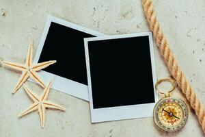 Nautical background with retro sunglasses and empty polaroid photos frames, sea shells