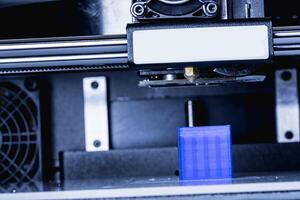 head of 3d printer in action photo