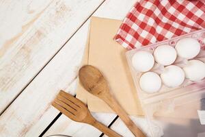 baking preparation, top view of a variety of baking utensils and ingredients photo