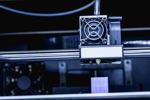 head of 3d printer in action photo