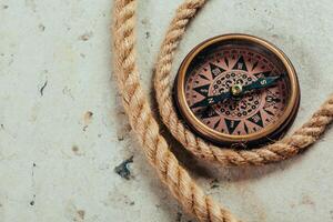 Compass on a gray gradient background photo