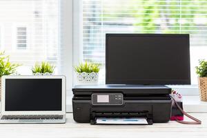 Printer and computer. Office table photo