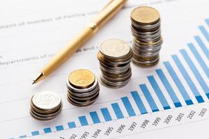 Graph Of Stock Market With Stacks Of Coins photo