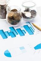Graph Of Stock Market With Stacks Of Coins photo
