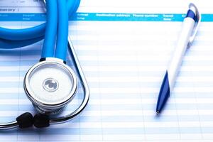 Empty prescription lying on table with stethoscope photo