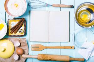 Preparation of the dough. Ingredients for the dough - Eggs and flour with a rolling pin. On wooden background. photo