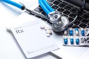 Medical stethoscope on computer keyboard photo
