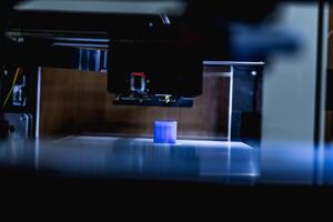 head of 3d printer in action photo