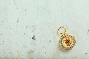 Compass on a gray gradient background photo