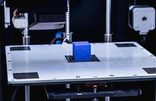 head of 3d printer in action photo