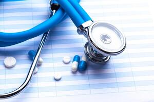 Empty prescription lying on table with stethoscope photo
