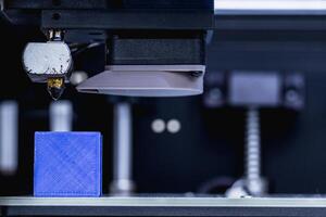 head of 3d printer in action photo