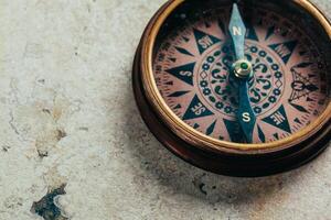 Compass on a gray gradient background photo