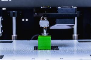 head of 3d printer in action photo