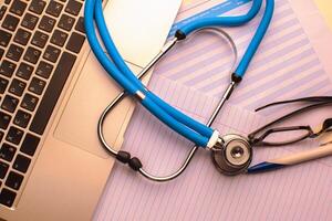 Medical stethoscope on computer keyboard photo