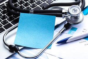 Medical stethoscope on computer keyboard photo