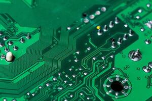 Close up of a printed green computer circuit board photo