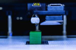 head of 3d printer in action photo
