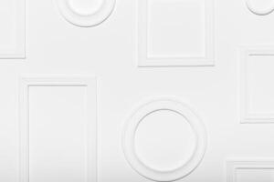 White wall with various empty frames ready for artwork display at an art gallery or exhibit photo