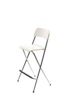 Simple white folding chair stands against a plain backdrop for versatile seating solutions in various settings photo