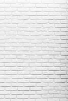 Textured white brick wall provides a clean background for creative designs and modern decor in various settings photo