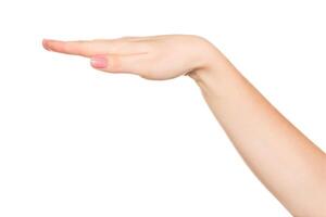 Hand gesture demonstrating a flat surface or level position in a neutral background setting photo
