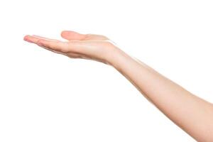 Hand is reaching out to receive something in a minimalistic, bright setting photo