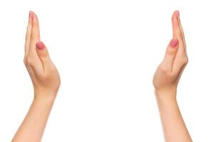 Hands positioned outward in a gesture of welcome or invitation in a minimalist setting photo