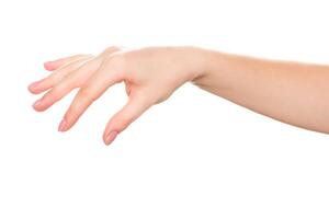 Delicate hand reaching out against plain background for expressive gesture capturing moment of connection photo