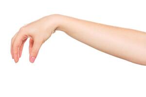 Hand reaching out with fingers slightly extended against a plain background in a neutral setting photo