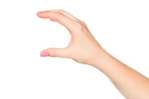 Hand shaping a pinching gesture against a plain background indicating a small size or delicate item photo