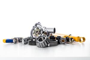 Engine parts and components arranged neatly on a work surface for automotive repair and maintenance photo