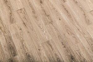 Realistic wooden floor with a natural finish in a well-lit indoor setting, showcasing texture and grain patterns photo