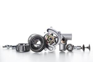 Various metal mechanical components arranged on a clean surface showcasing their intricate designs and functionality photo