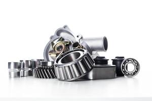 Engine components arranged aesthetically on a clean surface showcasing their intricate designs and functionalities photo